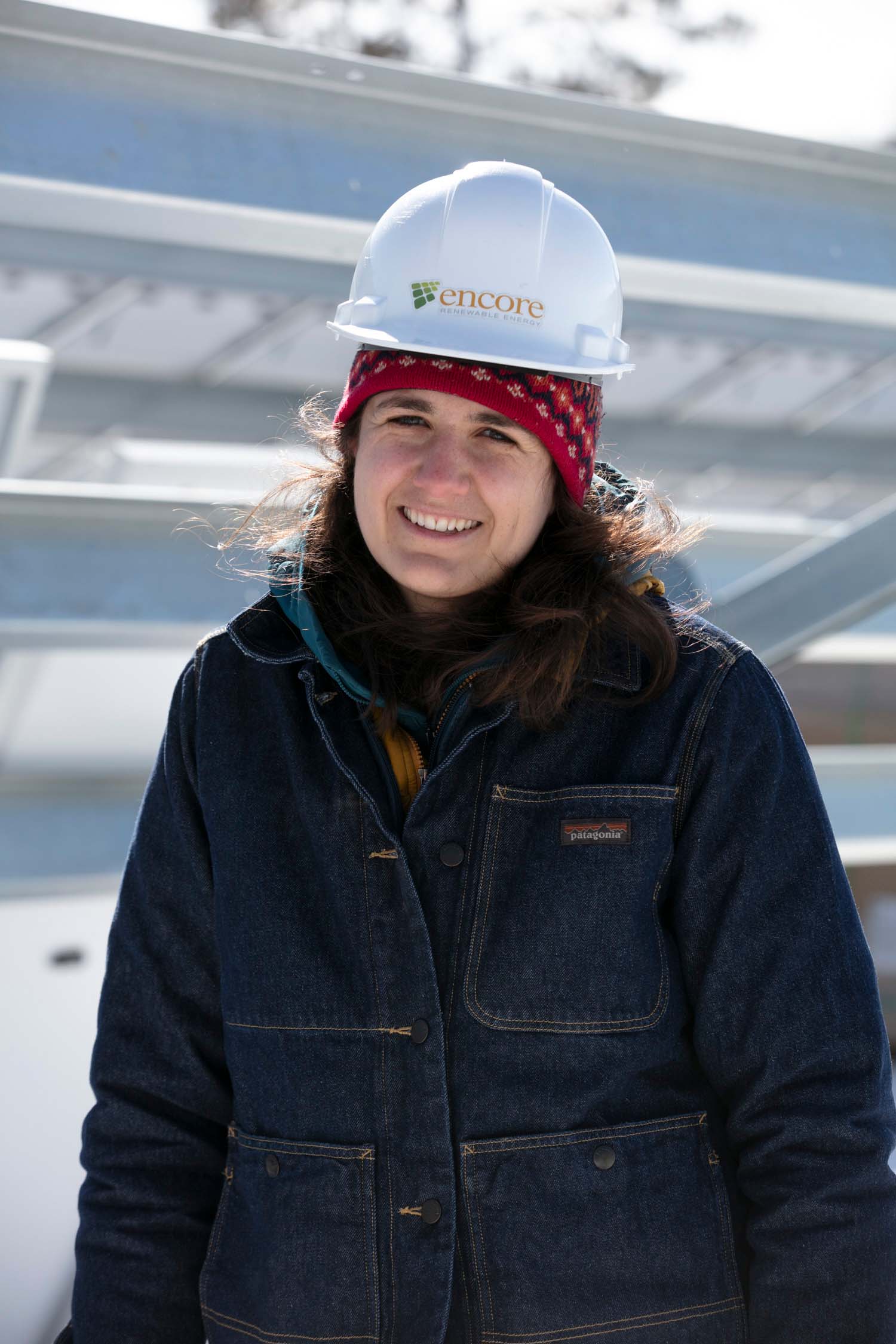 encore working with hard hat smiling