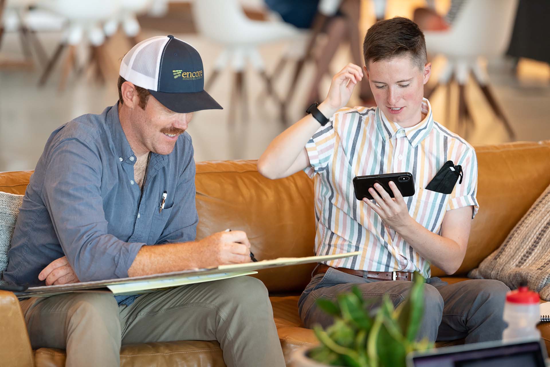 two encore employees on couch